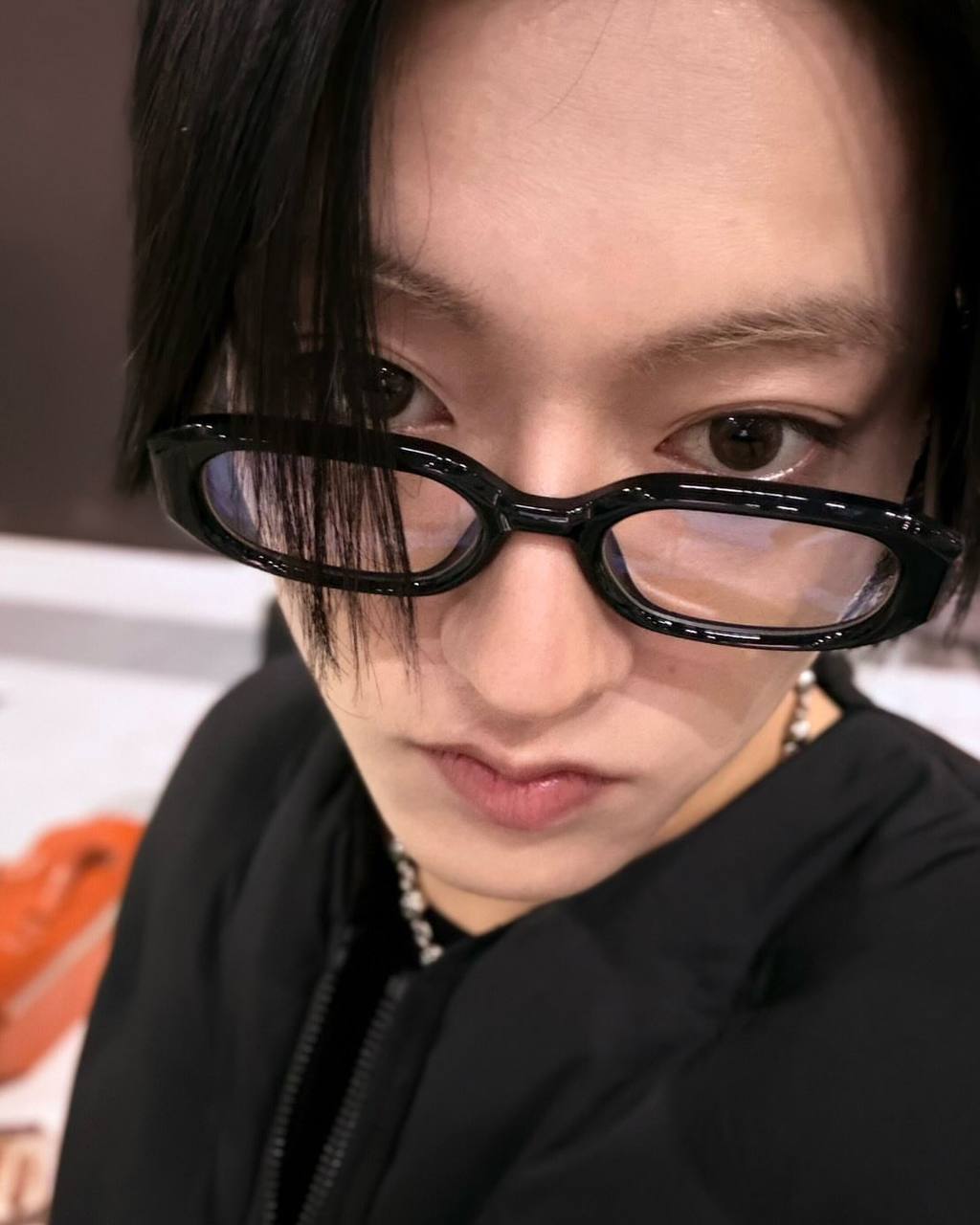 Harsha wearing black glasses and a black top