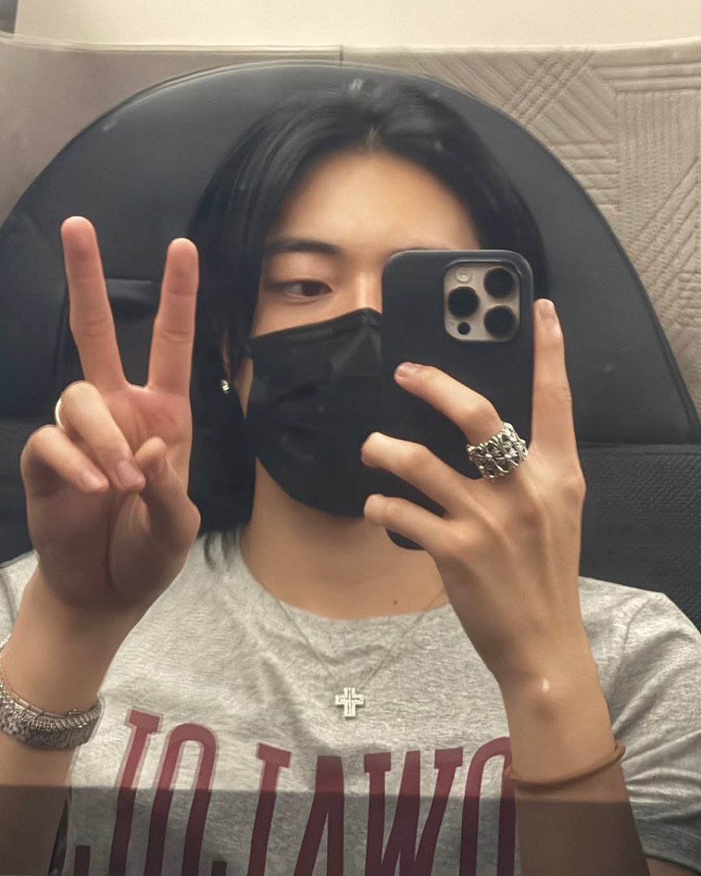 Harsha taking a mirror selfie with a peace sign